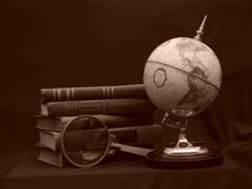 A globe and some books are on the table